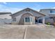 Backyard view of a single story home with covered patio and bay window feature at 11630 W Jefferson St, Avondale, AZ 85323