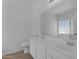 Bright bathroom featuring double sinks, a soaking tub, and modern fixtures at 11630 W Jefferson St, Avondale, AZ 85323