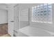 Bathroom with glass block window, shower and tub at 11630 W Jefferson St, Avondale, AZ 85323