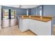 View of kitchen-area bar top and open-concept layout to the back living area at 11630 W Jefferson St, Avondale, AZ 85323