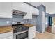 Bright kitchen features stainless steel appliances, white cabinets, and light brown countertops at 11630 W Jefferson St, Avondale, AZ 85323