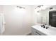 Bathroom with sleek gray vanity, matte black hardware, and modern lighting at 12830 S Wakial S Loop, Phoenix, AZ 85044