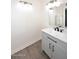 Bathroom with sleek gray vanity, matte black hardware, and modern lighting at 12830 S Wakial S Loop, Phoenix, AZ 85044