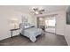 Bedroom featuring patio access, natural light, wood floors, and neutral decor at 12830 S Wakial S Loop, Phoenix, AZ 85044