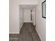 Entry way featuring laminate flooring, a coat closet, and white walls with white trim at 12830 S Wakial S Loop, Phoenix, AZ 85044