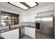 Bright kitchen featuring a window, stainless steel appliances, and wood countertops at 12830 S Wakial S Loop, Phoenix, AZ 85044