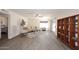Spacious living room featuring laminate floors, a sliding door, and neutral decor at 12830 S Wakial S Loop, Phoenix, AZ 85044