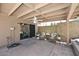 Cozy covered patio featuring tiled flooring and outdoor seating area, ideal for relaxing at 12830 S Wakial S Loop, Phoenix, AZ 85044