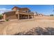 Large backyard with a covered patio, offering an excellent opportunity for landscaping and recreation at 13617 W Crocus Dr, Surprise, AZ 85379