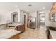 Kitchen featuring stainless steel appliances, a bar, and wood cabinetry, blending functionality with style at 13617 W Crocus Dr, Surprise, AZ 85379