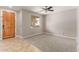 Inviting living room with neutral paint, carpet, tile flooring, and natural light at 13617 W Crocus Dr, Surprise, AZ 85379