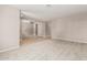 Bright and airy living room offering tile and carpet flooring and neutral walls at 13617 W Crocus Dr, Surprise, AZ 85379