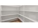 Walk-in pantry offers ample storage space with its extensive shelving system, keeping your kitchen organized at 13617 W Crocus Dr, Surprise, AZ 85379