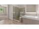 Bathroom with separate shower and soaking tub, and tile flooring at 14657 N 103Rd Way, Scottsdale, AZ 85255