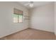 Bedroom with carpet flooring and window at 14657 N 103Rd Way, Scottsdale, AZ 85255