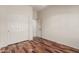 Bedroom with wood floors and closet at 14657 N 103Rd Way, Scottsdale, AZ 85255