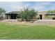 Community clubhouse with covered patio, landscaping, and spacious green lawn at 14657 N 103Rd Way, Scottsdale, AZ 85255