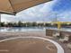Community pool area with shallow splash pad and various amenities for residents at 14657 N 103Rd Way, Scottsdale, AZ 85255