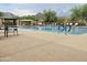 Resort-style community pool featuring multiple lanes, lounge chairs, and desert landscaping at 14657 N 103Rd Way, Scottsdale, AZ 85255