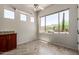 Bright dining area with tile floors, granite counter and desert views from multiple windows at 14657 N 103Rd Way, Scottsdale, AZ 85255