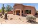 Home exterior with desert landscaping, a covered patio, and an expansive backyard view at 14657 N 103Rd Way, Scottsdale, AZ 85255