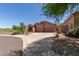 Single-story desert home with a spacious driveway and xeriscaped front yard at 14657 N 103Rd Way, Scottsdale, AZ 85255