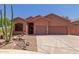 Charming single-story home with a two-car garage and desert landscaping at 14657 N 103Rd Way, Scottsdale, AZ 85255