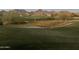 Expansive green golf course with sand traps and desert vegetation at 14657 N 103Rd Way, Scottsdale, AZ 85255