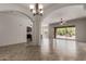 Open-concept living area with tiled floors and seamless flow to the outdoors at 14657 N 103Rd Way, Scottsdale, AZ 85255