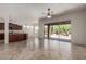 Open living room with tile flooring and large sliding doors to the backyard offering indoor/outdoor living at 14657 N 103Rd Way, Scottsdale, AZ 85255
