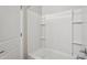 Bright bathroom featuring a white bathtub and tiled shower surround at 14870 W Encanto Blvd # 1091, Goodyear, AZ 85395