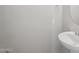 Bathroom featuring a white sink, neutral walls, and modern fixtures at 14870 W Encanto Blvd # 1091, Goodyear, AZ 85395