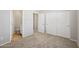 Bedroom featuring neutral carpet, open doors, and a closet at 14870 W Encanto Blvd # 1091, Goodyear, AZ 85395