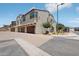 Charming stucco townhome with three-car garage and tile roof, set in a well-maintained community at 14870 W Encanto Blvd # 1091, Goodyear, AZ 85395
