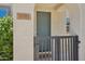 Close up of front door with security gate and shrubbery at 14870 W Encanto Blvd # 1091, Goodyear, AZ 85395
