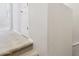 Carpeted stairs leading to a hallway with neutral walls and white trim at 14870 W Encanto Blvd # 1091, Goodyear, AZ 85395