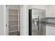 Modern kitchen with stainless steel refrigerator and pantry storage at 14870 W Encanto Blvd # 1091, Goodyear, AZ 85395