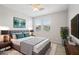 Staged bedroom with a queen bed, soft lighting, and coordinated décor at 14870 W Encanto Blvd # 1091, Goodyear, AZ 85395