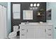 Stylish bathroom with modern fixtures, black accent wall, bright lighting, and ample vanity space at 1492 W Bruce Ave, Gilbert, AZ 85233