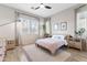 Bright bedroom with a calming decor, featuring large windows with views of the outdoors at 1492 W Bruce Ave, Gilbert, AZ 85233