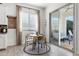 Bright dining nook features a round table, modern chairs, and sliding doors to the backyard patio at 1492 W Bruce Ave, Gilbert, AZ 85233