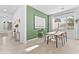 Dining room featuring bright walls, natural light, contemporary decor, and a long dining table at 1492 W Bruce Ave, Gilbert, AZ 85233