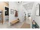 Bright entryway with modern lighting, tiled floors, and stylish decor with a bench for seating at 1492 W Bruce Ave, Gilbert, AZ 85233