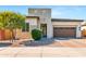 Inviting exterior featuring desert landscaping, a modern design and a two-car garage for easy parking at 1492 W Bruce Ave, Gilbert, AZ 85233