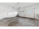 Spacious garage with ample storage space and high ceilings, offering plenty of room for vehicles and projects at 1492 W Bruce Ave, Gilbert, AZ 85233