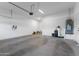 Spacious two car garage with epoxy floors, water heater, and EV charger at 1492 W Bruce Ave, Gilbert, AZ 85233