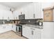 Modern kitchen showcasing white cabinets, granite countertops, and stainless steel appliances for a sleek look at 1492 W Bruce Ave, Gilbert, AZ 85233
