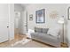 Cozy living room with a gray couch, stylish decor, and plenty of natural light from an adjacent window at 1492 W Bruce Ave, Gilbert, AZ 85233