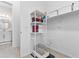 Bright mud room with built-in shelving and organization solutions, conveniently located near a full bathroom at 1492 W Bruce Ave, Gilbert, AZ 85233
