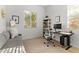 Bright home office with a gray couch, modern desk, rolling chair, and natural light from the large window at 1492 W Bruce Ave, Gilbert, AZ 85233